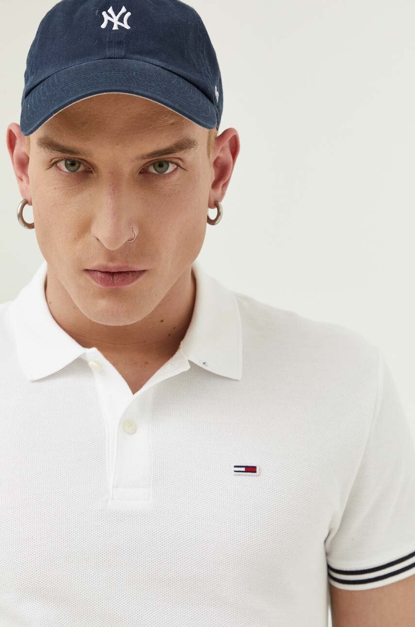 

Бавовняне поло Tommy Jeans колір чорний з аплікацією
