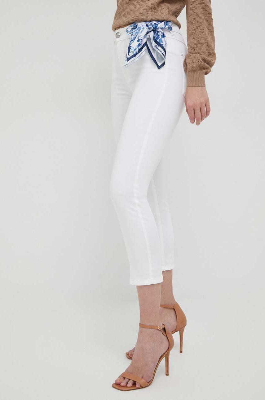 Kalhoty Guess dámské, bílá barva, přiléhavé, high waist - bílá -  Hlavní materiál: 54 % Lyocell