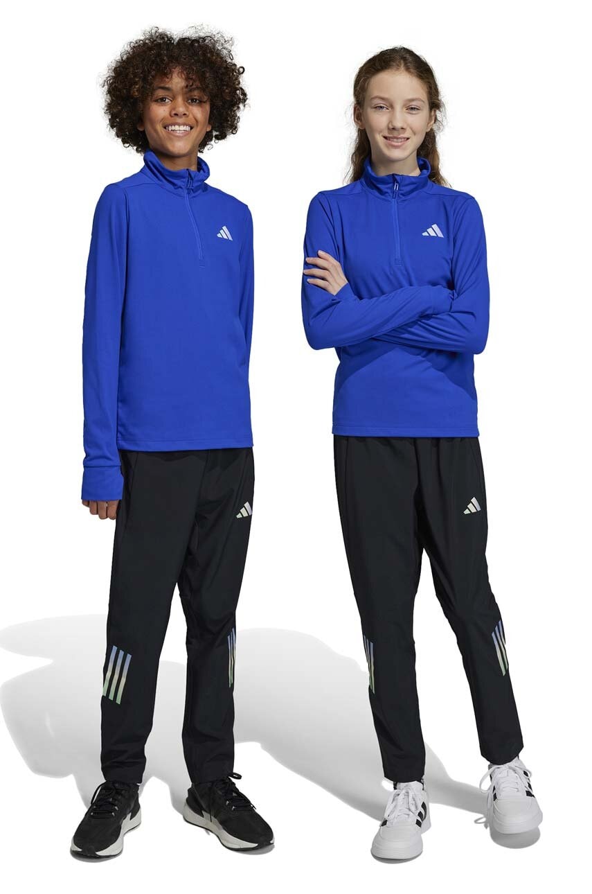 Levně Dětské tepláky adidas U RUN WV černá barva, s potiskem