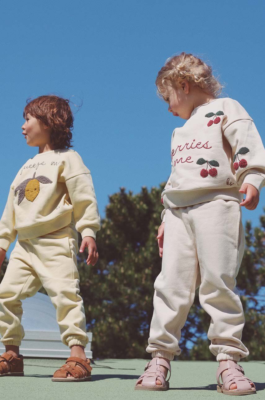 Konges Sløjd pantaloni de trening pentru copii culoarea bej, neted
