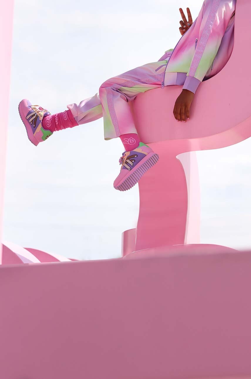 Дитячі спортивні штани Reima колір фіолетовий візерунок