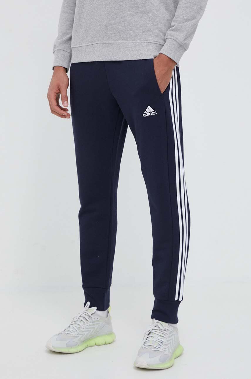 Bavlněné tepláky adidas tmavomodrá barva, s aplikací