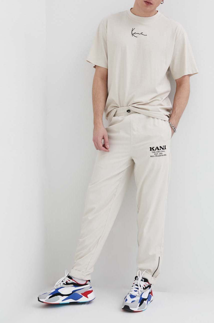 Kalhoty Karl Kani pánské, béžová barva - béžová -  100 % Polyester