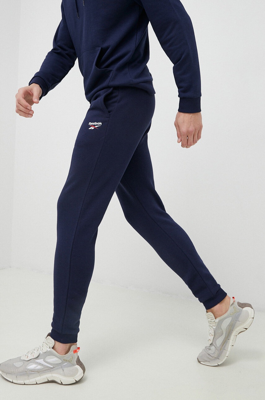 

Спортивні штани Reebok колір синій однотонні