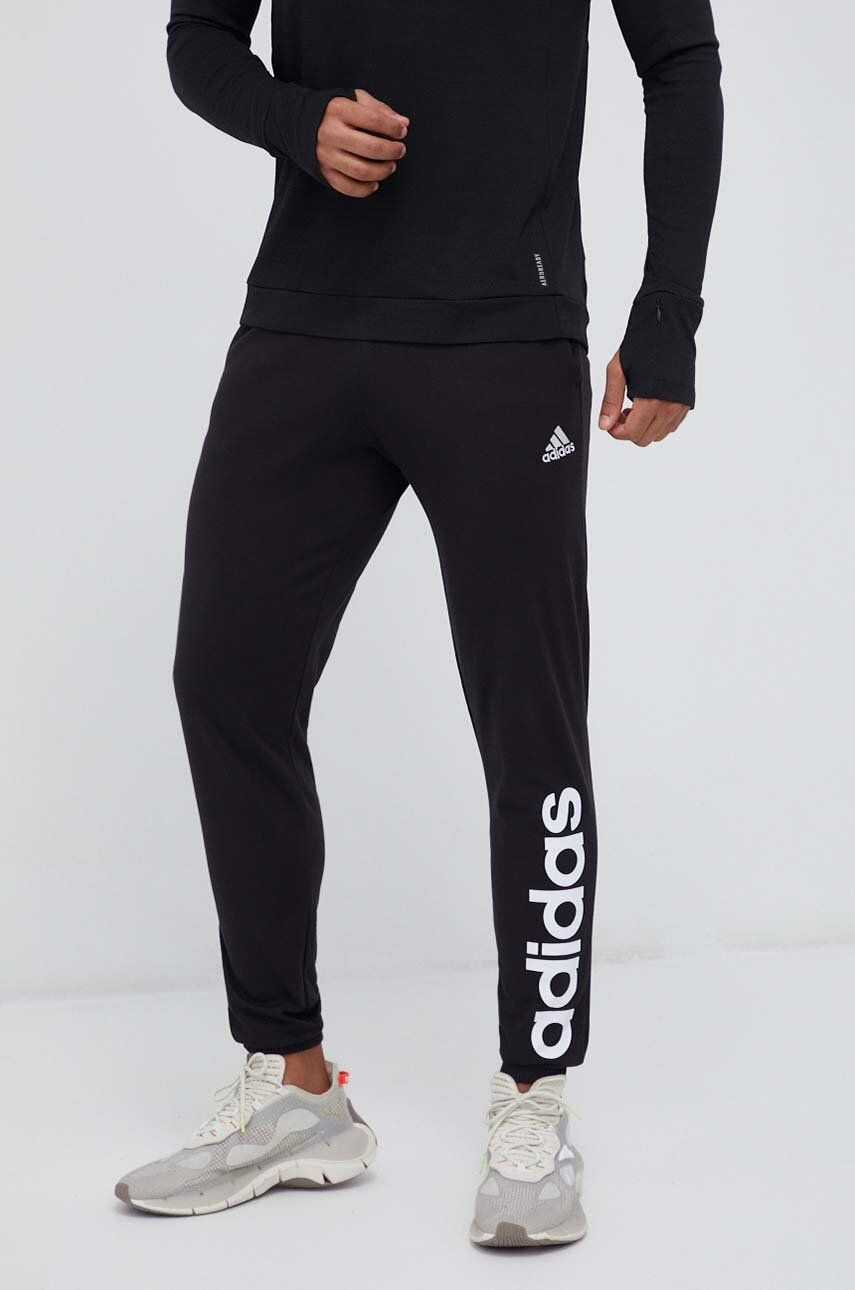 Tréninkové kalhoty adidas černá barva, s potiskem