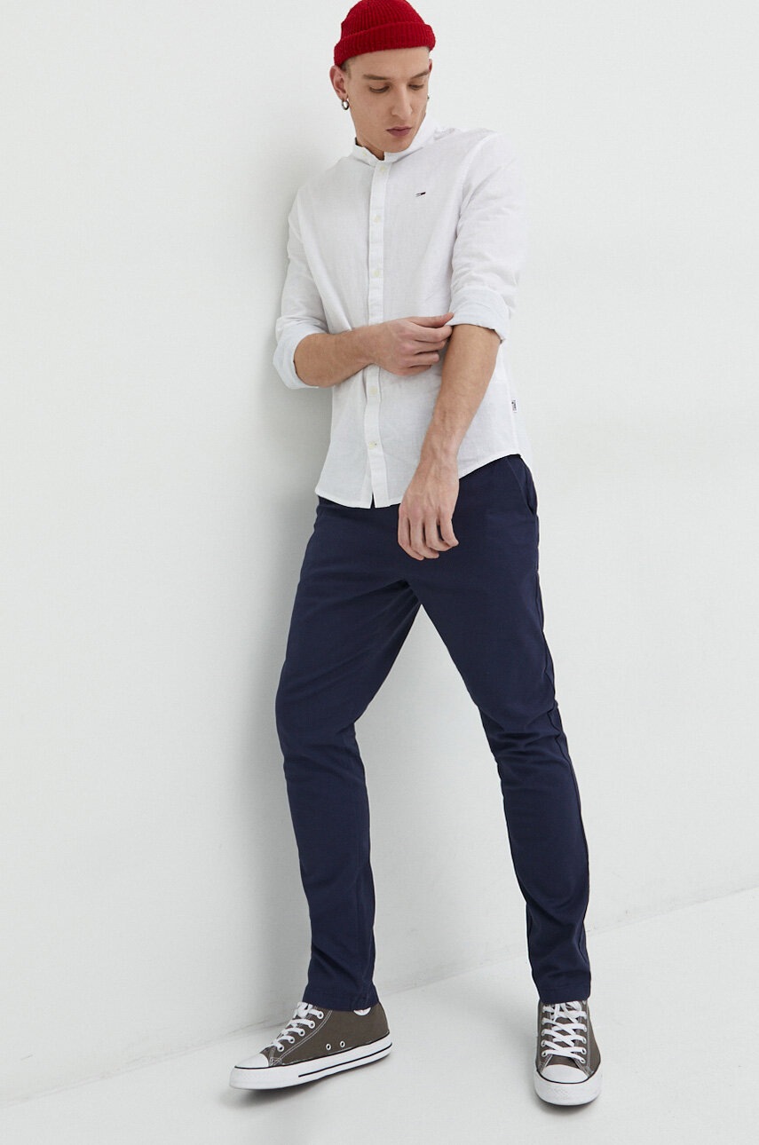 

Брюки Tommy Jeans мужские цвет синий облегающее