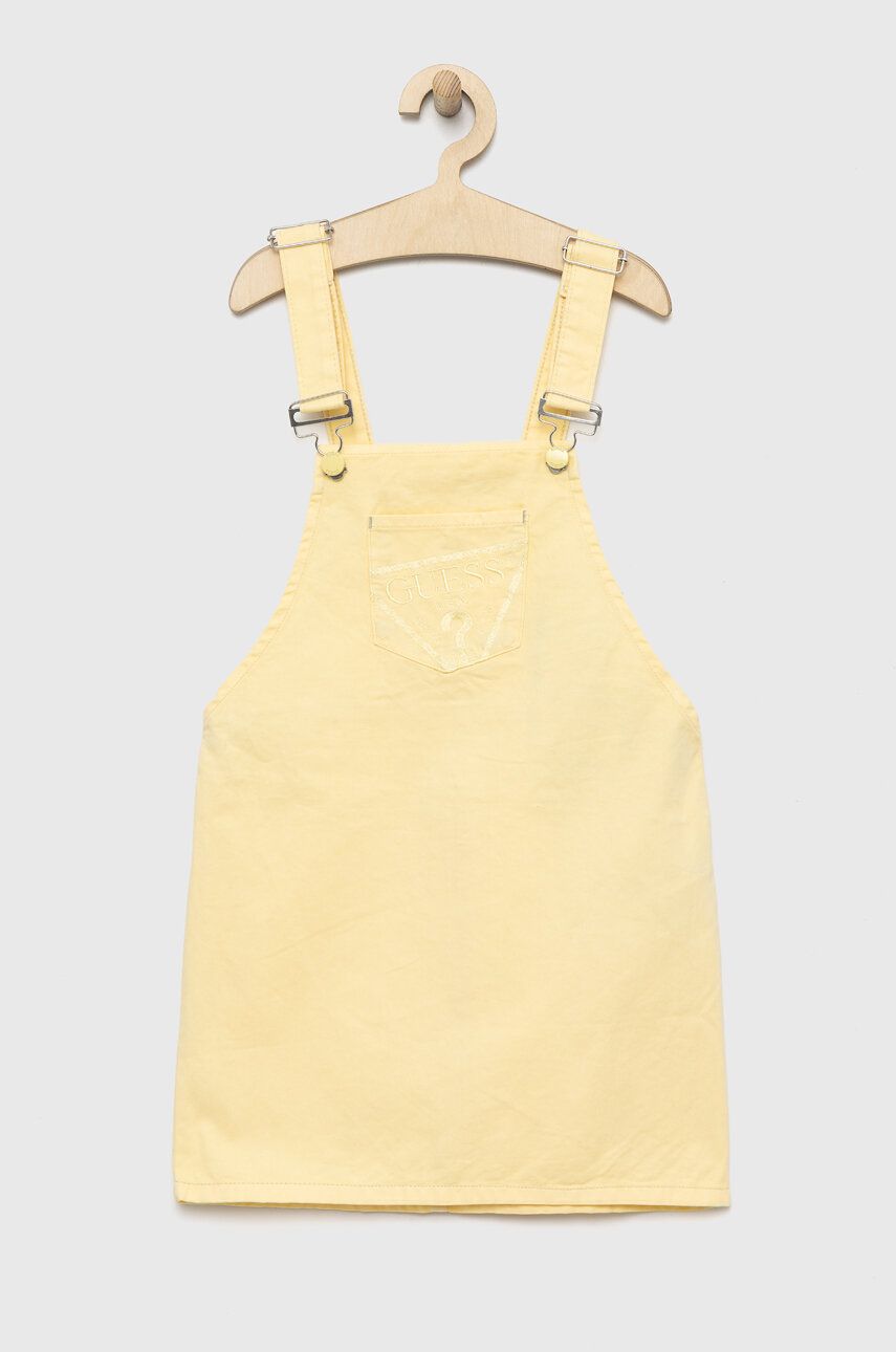 Levně Dětské riflové šaty Guess žlutá barva, mini