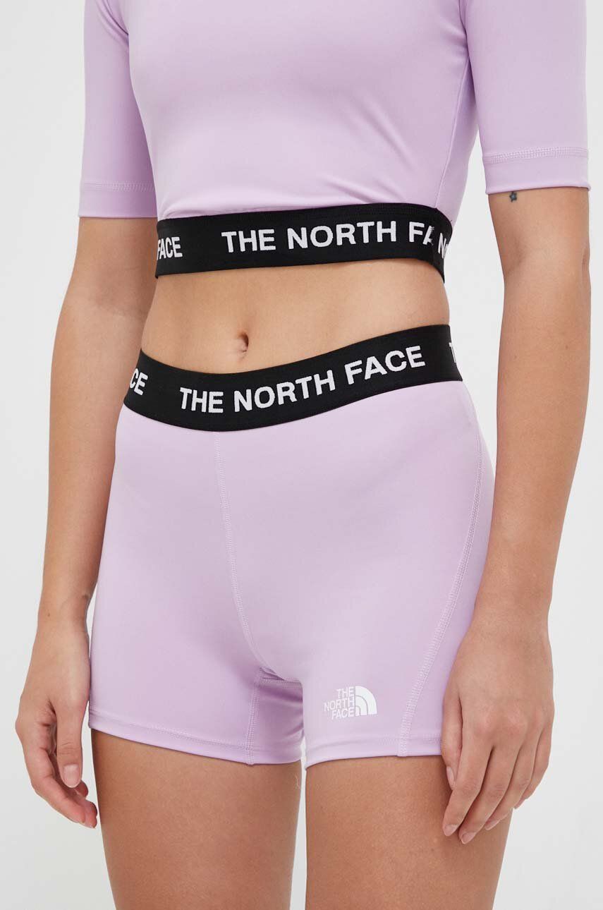 Tréninkové šortky The North Face fialová barva, s potiskem, medium waist - fialová -  91 % Poly