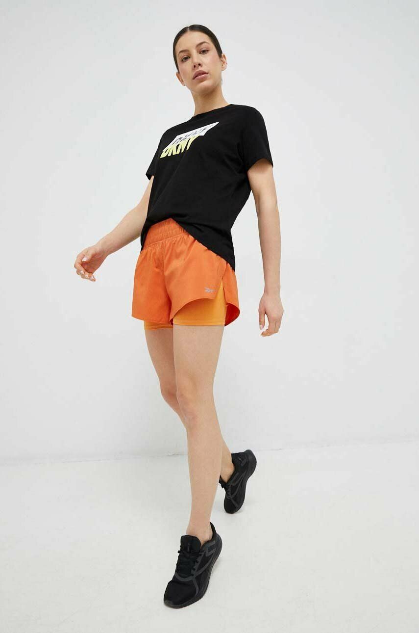 Levně Běžecké šortky Reebok oranžová barva, medium waist