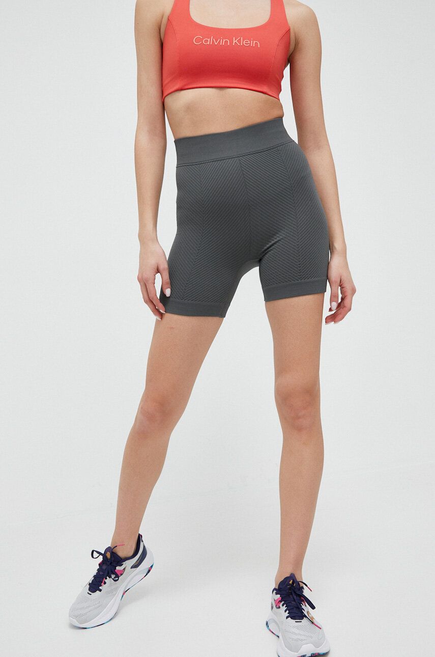 Levně Tréninkové šortky Calvin Klein Performance Essentials zelená barva, hladké, high waist