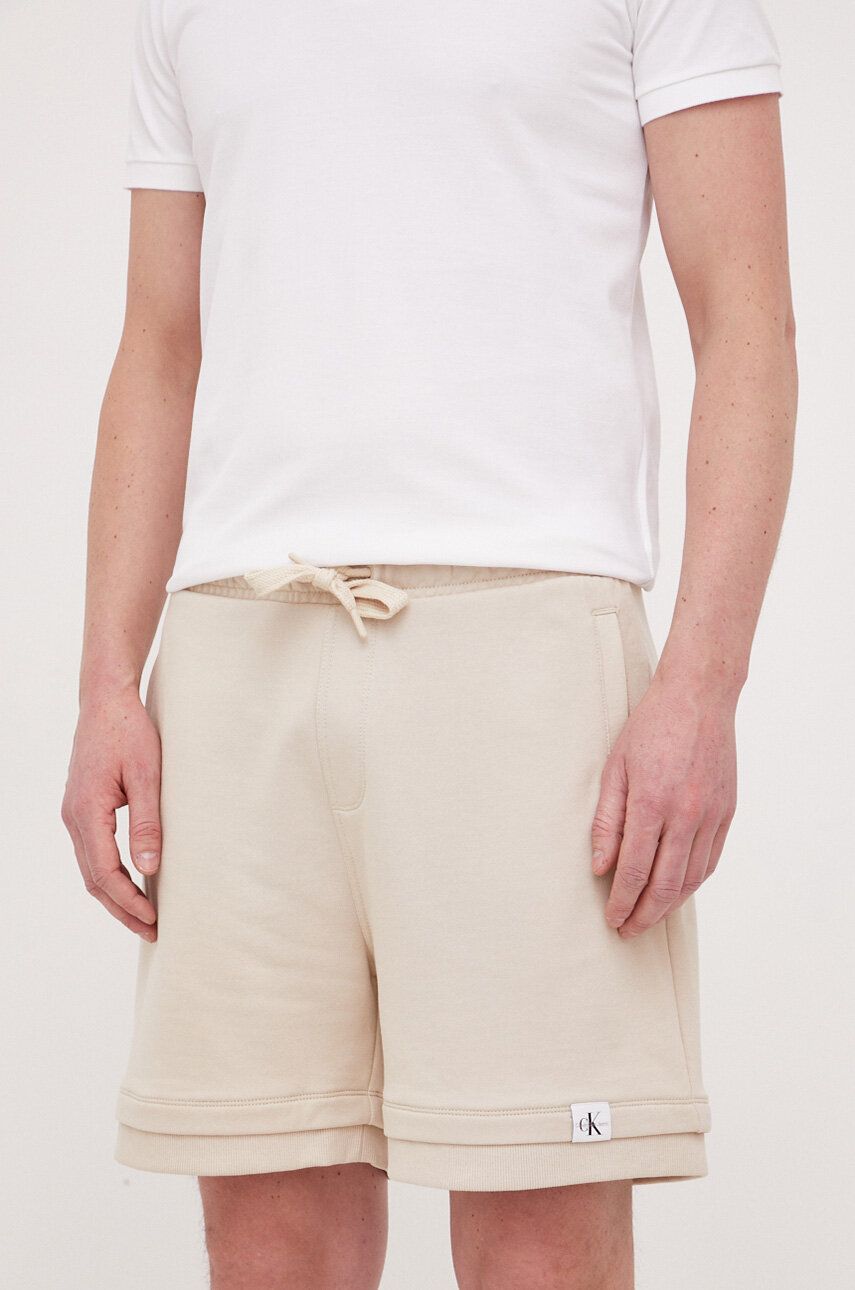 Kraťasy Calvin Klein Jeans pánské, béžová barva - béžová -  52 % Bavlna