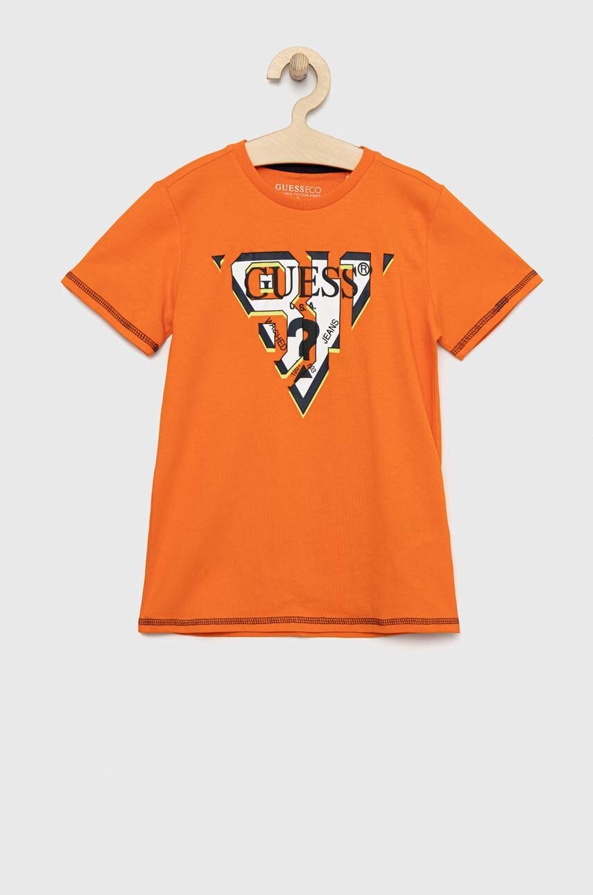 

Детская хлопковая футболка Guess цвет оранжевый с принтом