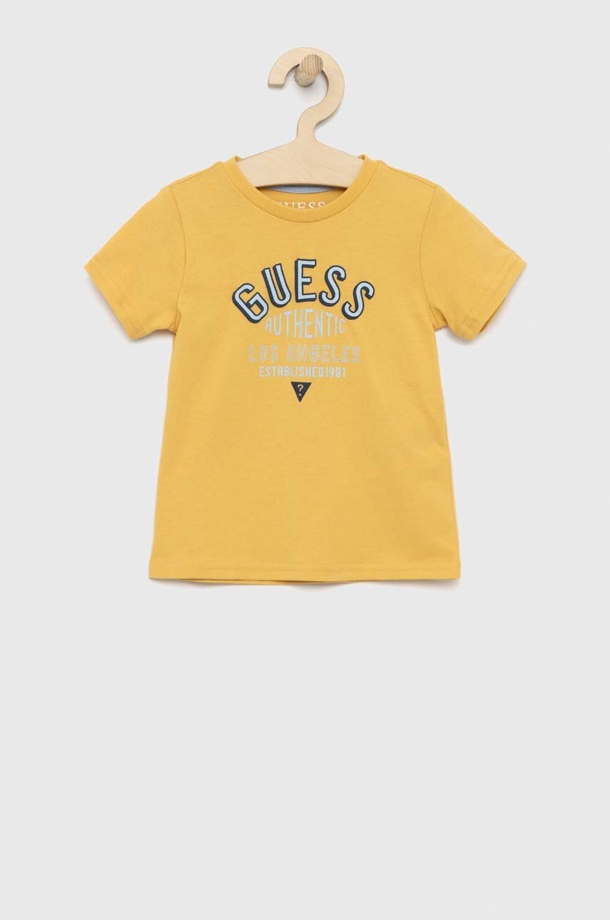 

Дитяча бавовняна футболка Guess колір жовтий з принтом