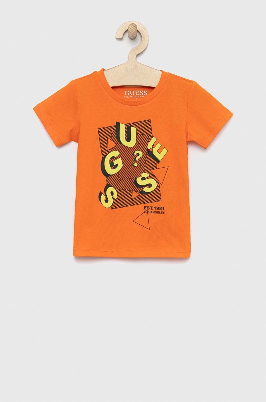 

Детская хлопковая футболка Guess цвет оранжевый узорная