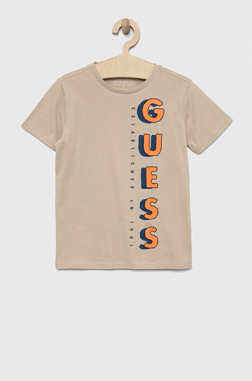 

Детская хлопковая футболка Guess цвет бежевый с принтом