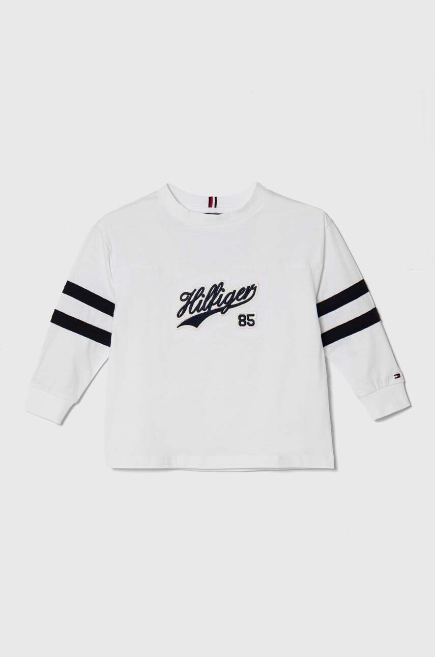 

Дитячий бавовняний лонгслів Tommy Hilfiger колір білий з аплікацією