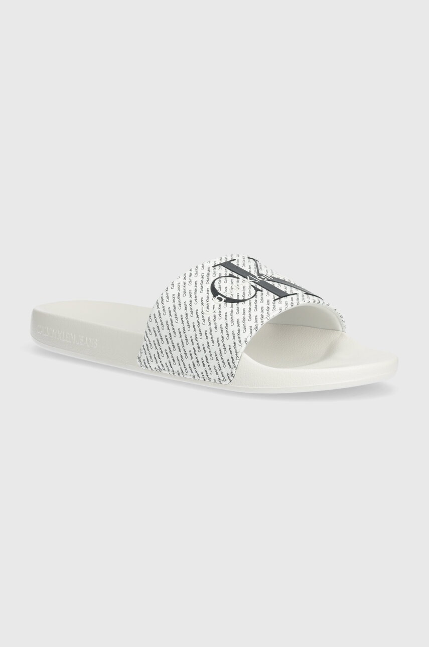 Levně Pantofle Calvin Klein Jeans SLIDE AOP pánské, bílá barva, YM0YM00955