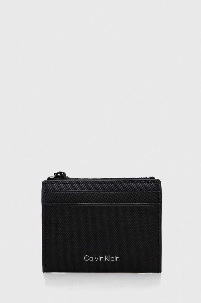 Levně Kožená peněženka Calvin Klein černá barva, K50K511282