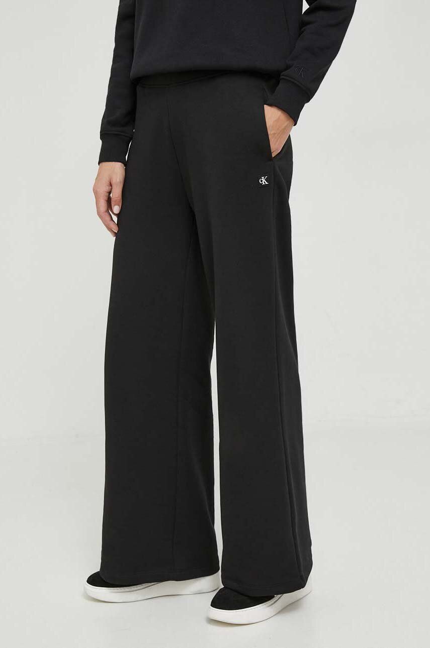Levně Tepláky Calvin Klein Jeans černá barva, jednoduché, high waist, J20J222597
