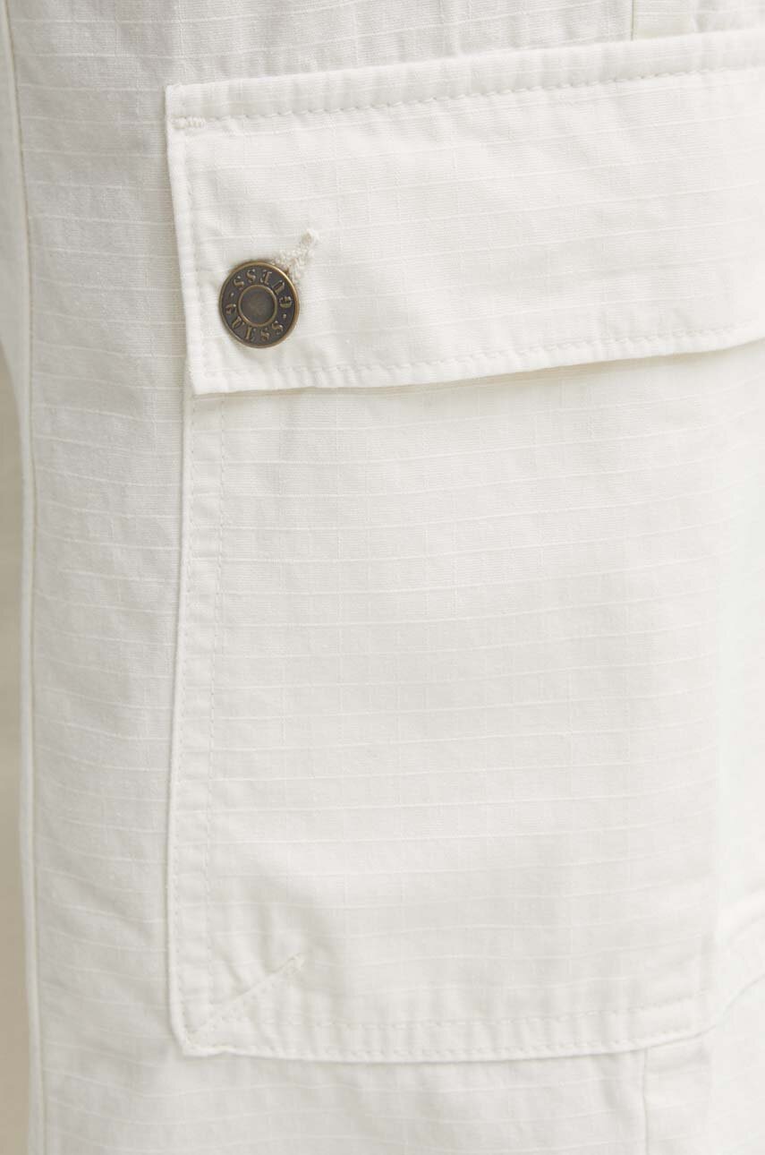 Παντελόνι Guess Originals χρώμα: μπεζ φωτογραφία