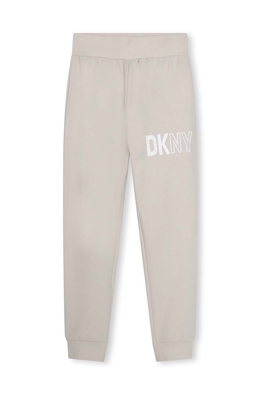 Дитячі бавовняні штани Dkny колір білий з принтом