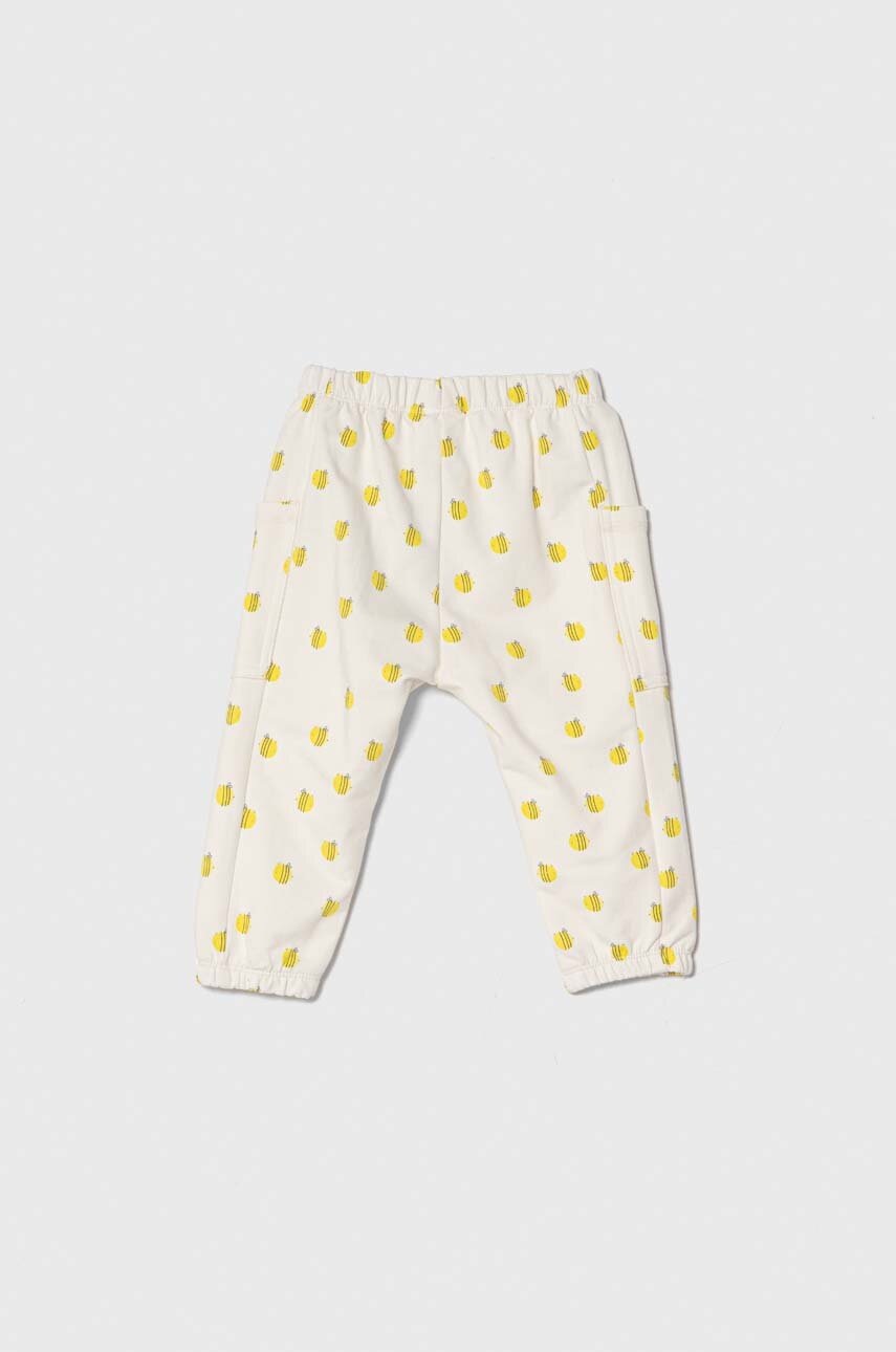 Дитячі спортивні штани United Colors of Benetton колір бежевий візерунок