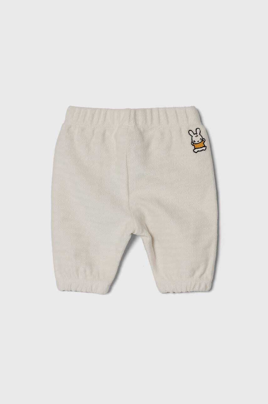 Бавовняні штани для немовлят United Colors of Benetton колір бежевий меланж