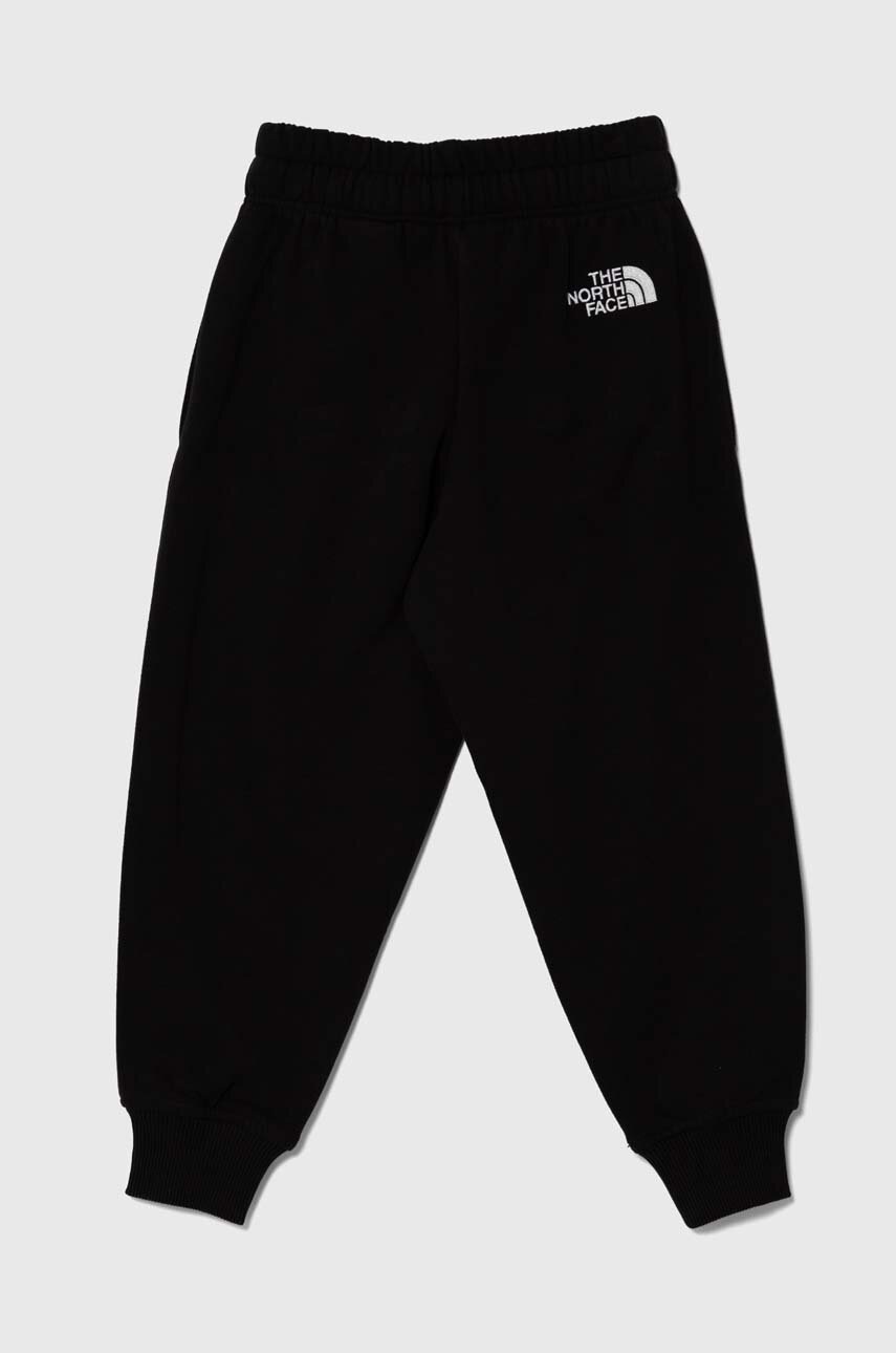 Дитячі бавовняні штани The North Face OVERSIZED JOGGERS колір чорний однотонні