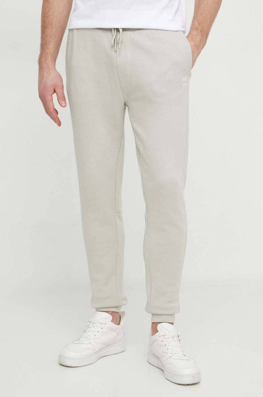 BOSS Orange pantaloni de trening din bumbac culoarea bej, melanj