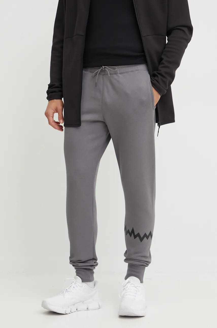Puma pantaloni de trening Hoops culoarea gri, cu imprimeu, 676649 Puma pantaloni de trening Hoops culoarea gri, cu imprimeu, 676649