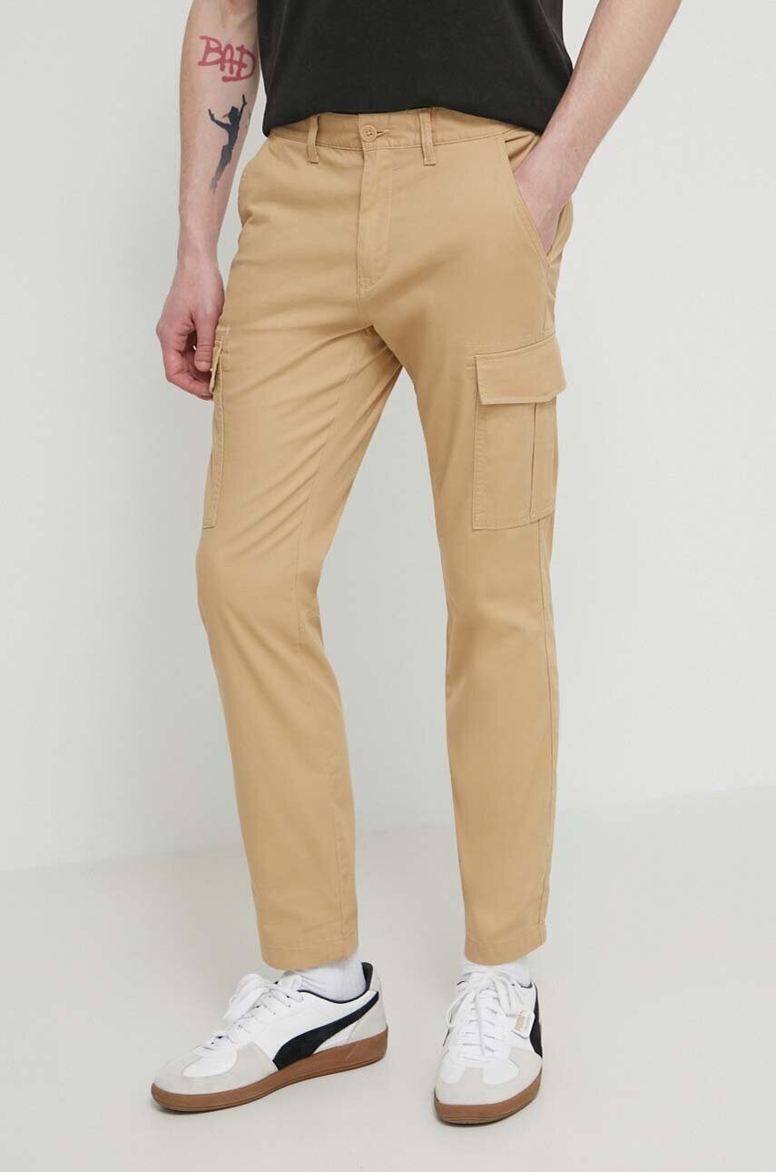 Tommy Jeans pantaloni barbati, culoarea bej, mulata DM0DM18940