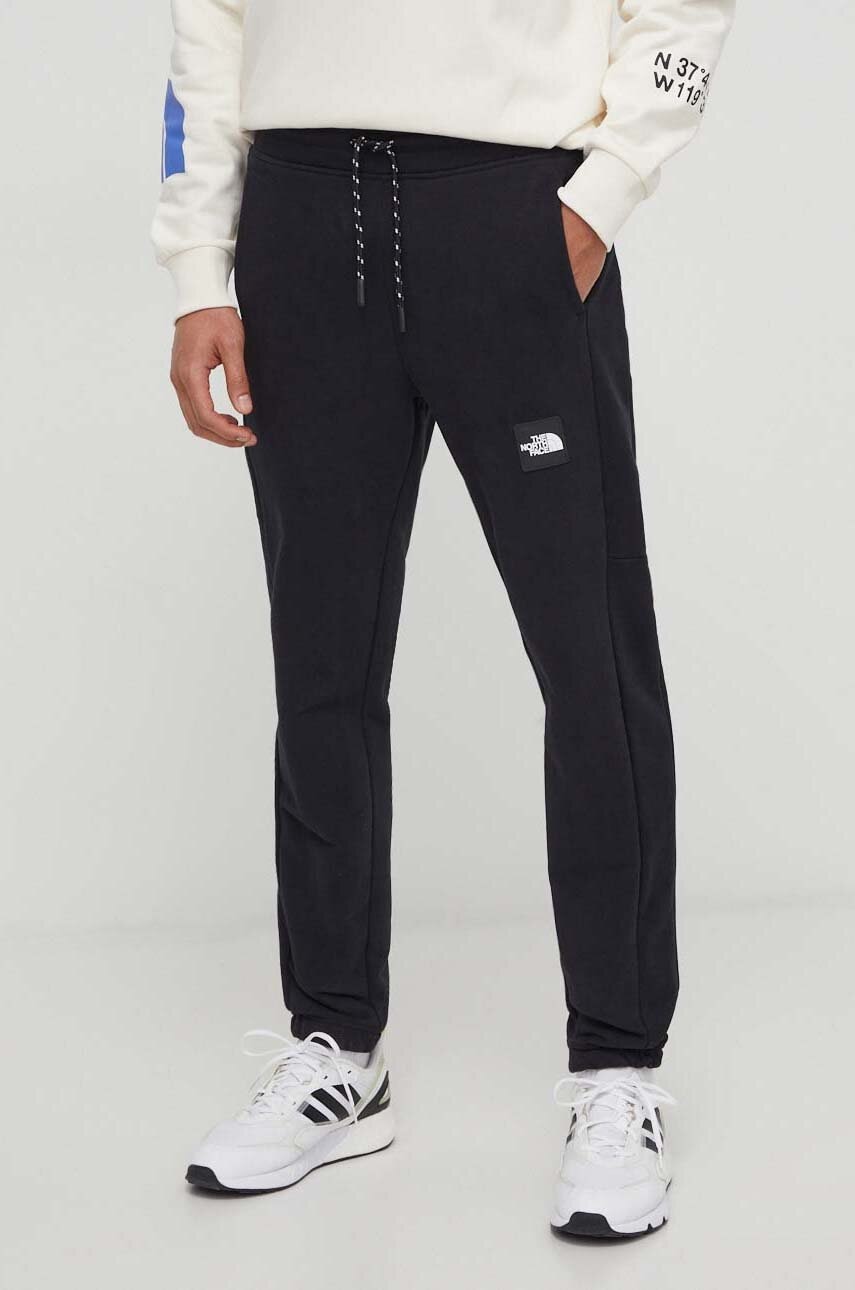 The North Face pantaloni de trening din bumbac culoarea negru, cu imprimeu