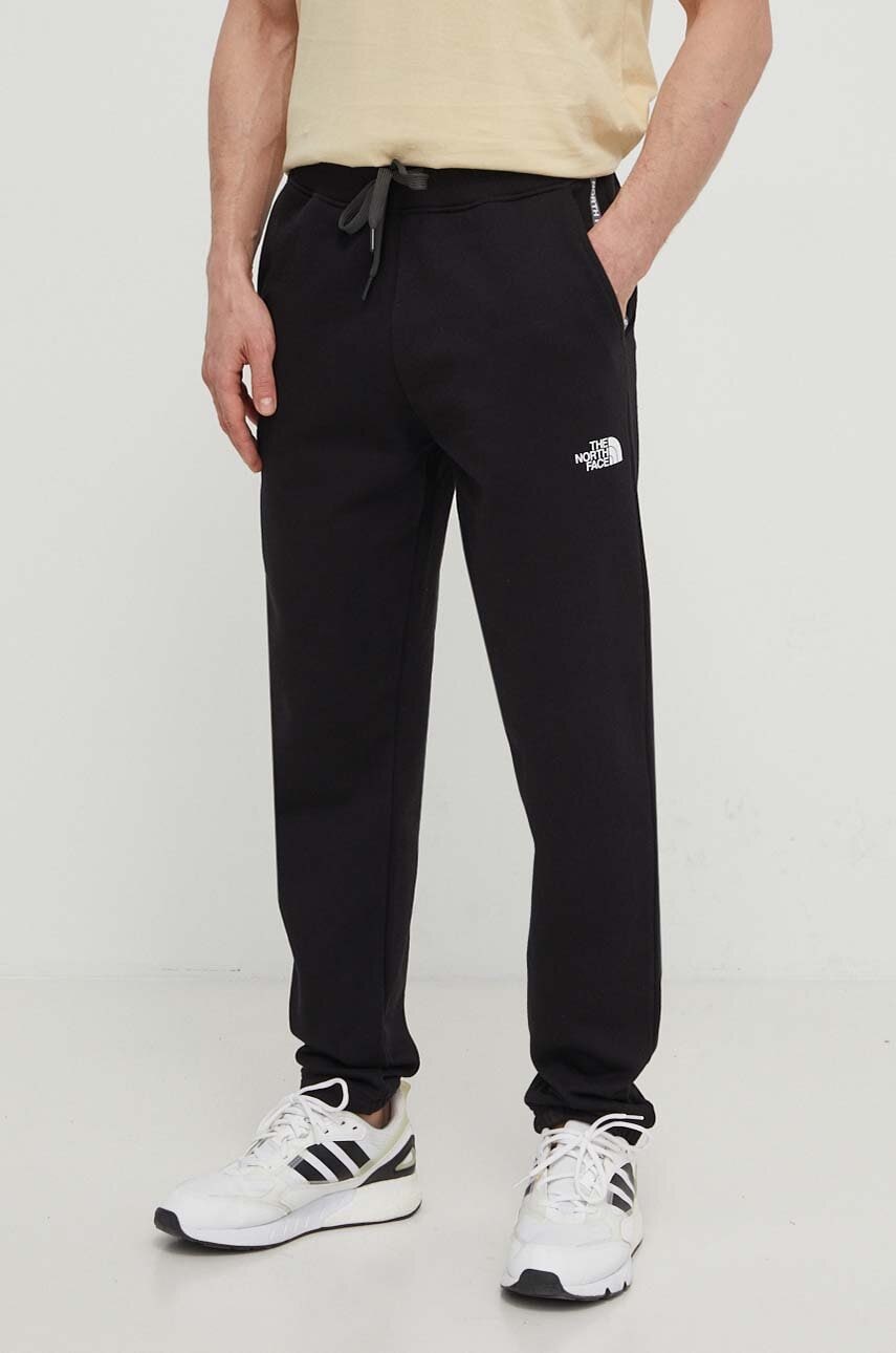 The North Face pantaloni de trening din bumbac culoarea negru, cu imprimeu, NF0A87DEJK31