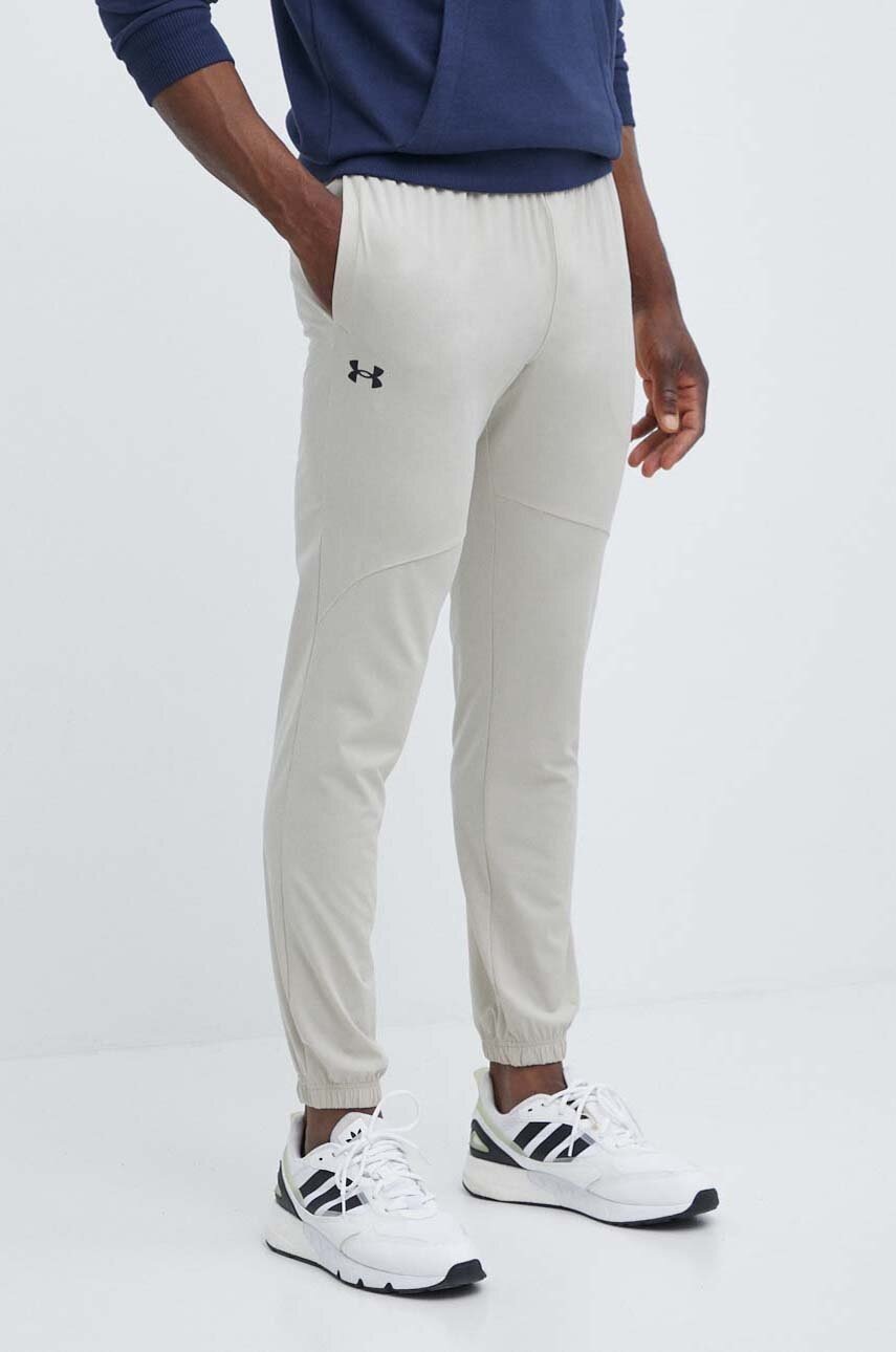 

Спортен панталон Under Armour в бежово с изчистен дизайн, Бежов