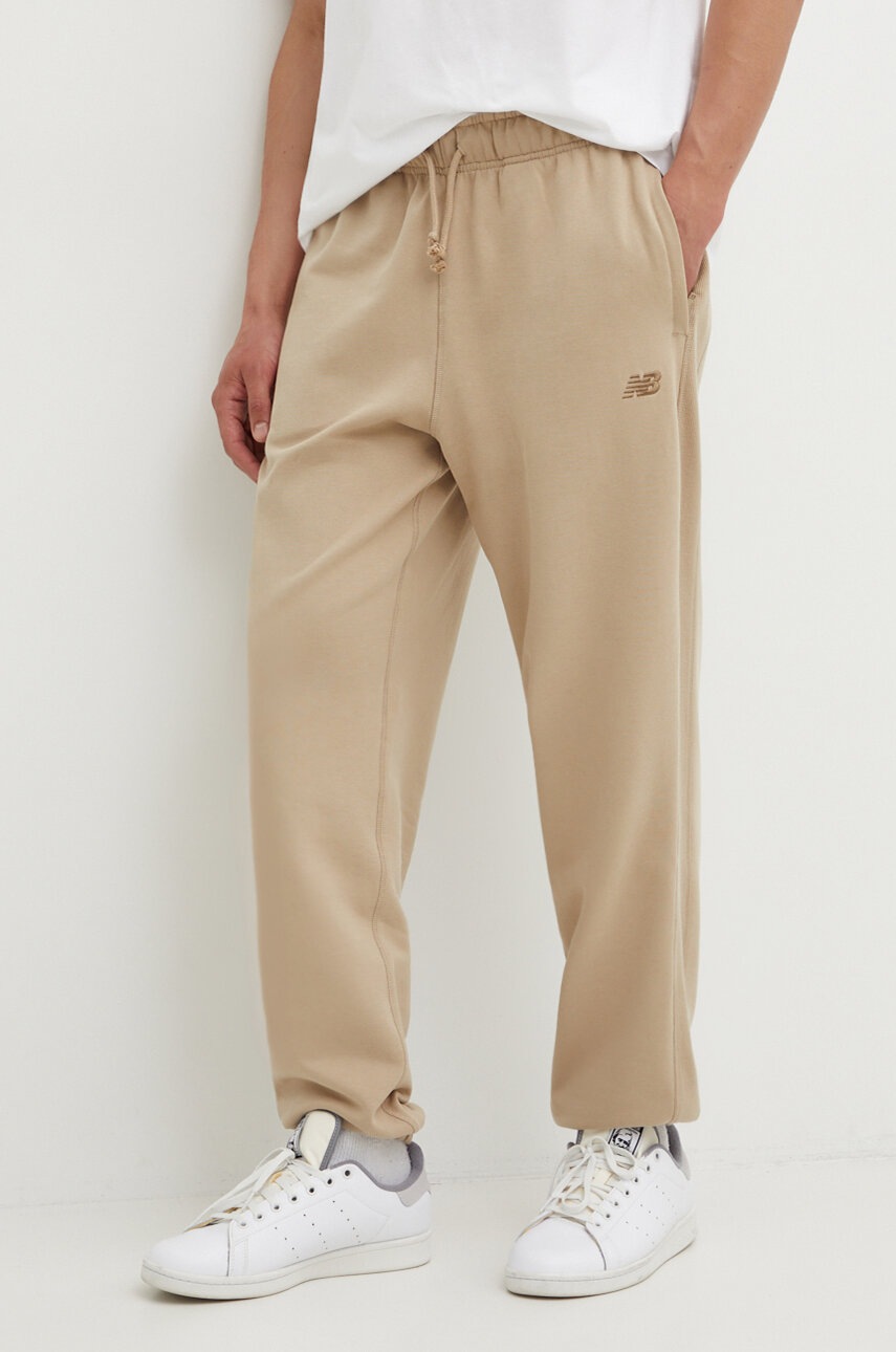 New Balance pantaloni de trening din bumbac culoarea bej, neted
