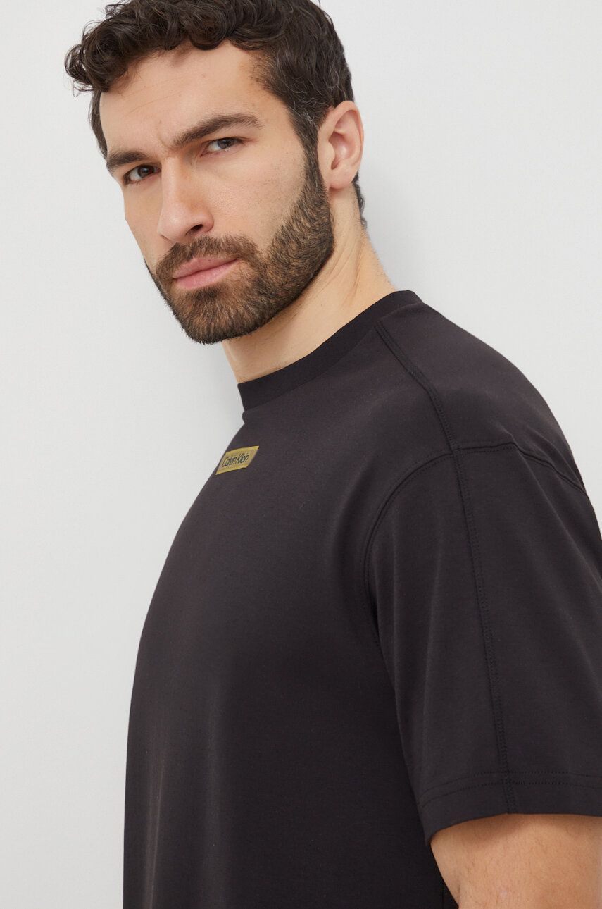Levně Bavlněné tričko Calvin Klein černá barva, s potiskem