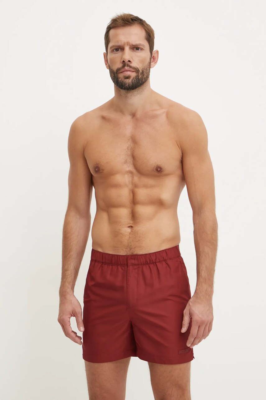 Levně Plavkové šortky Calvin Klein červená barva, KM0KM01084