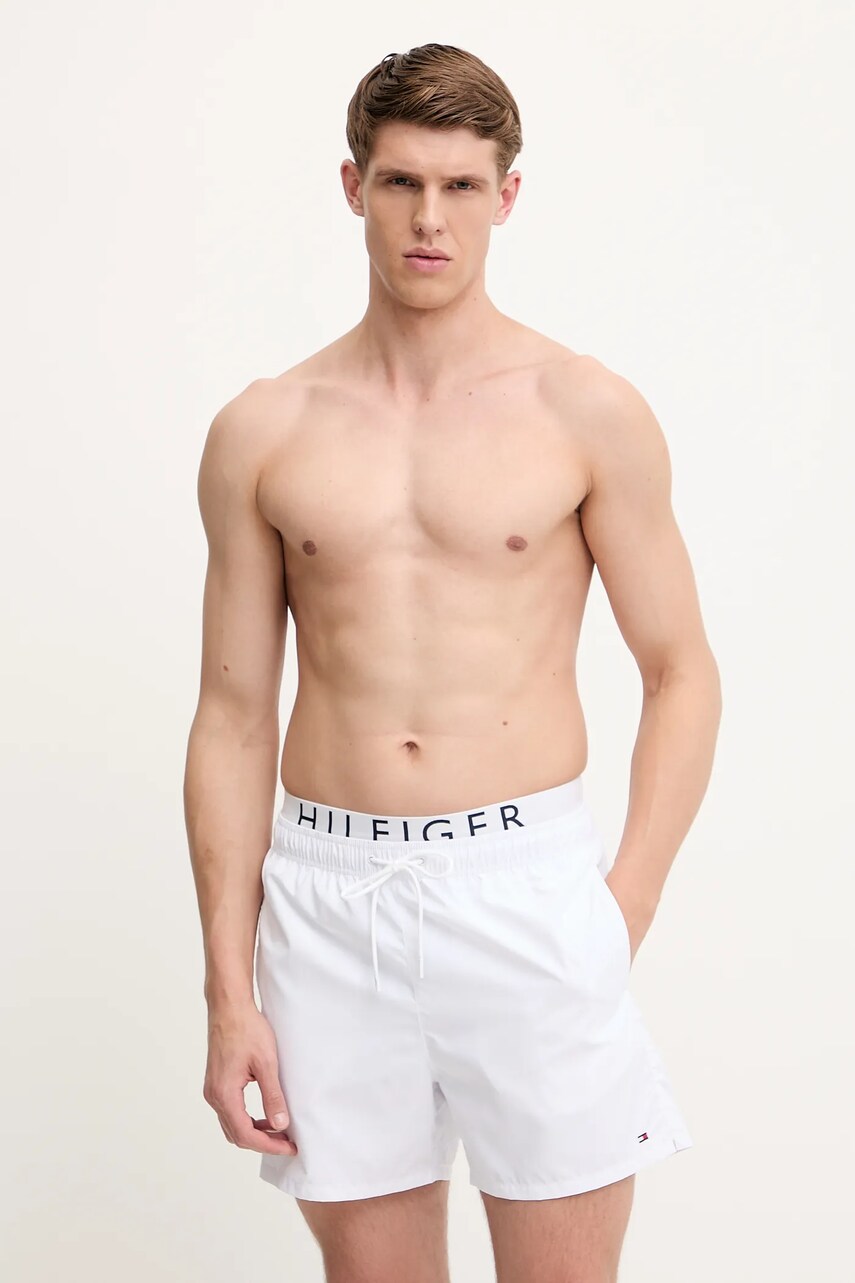 Levně Plavkové šortky Tommy Hilfiger bílá barva, UM0UM03489