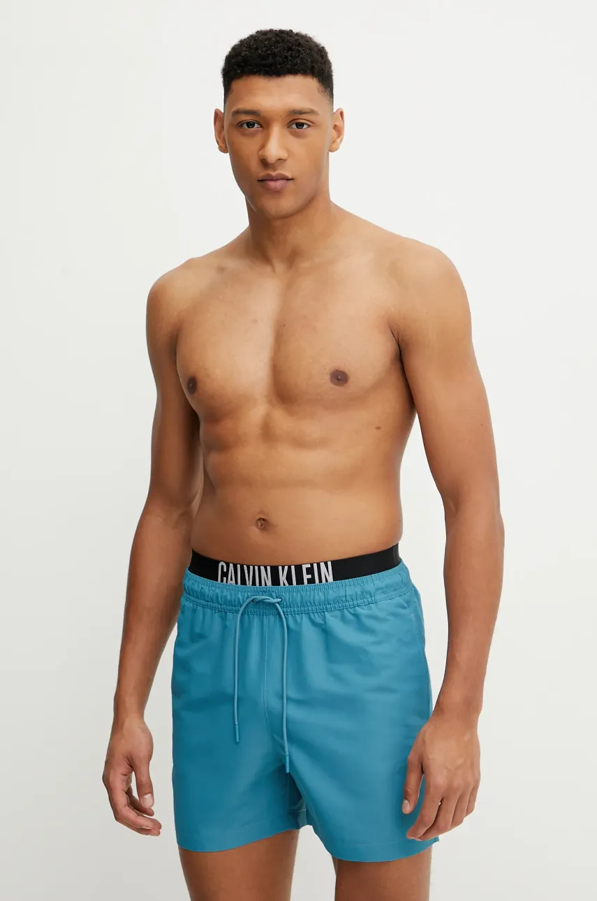 Levně Plavkové šortky Calvin Klein zelená barva, KM0KM01093