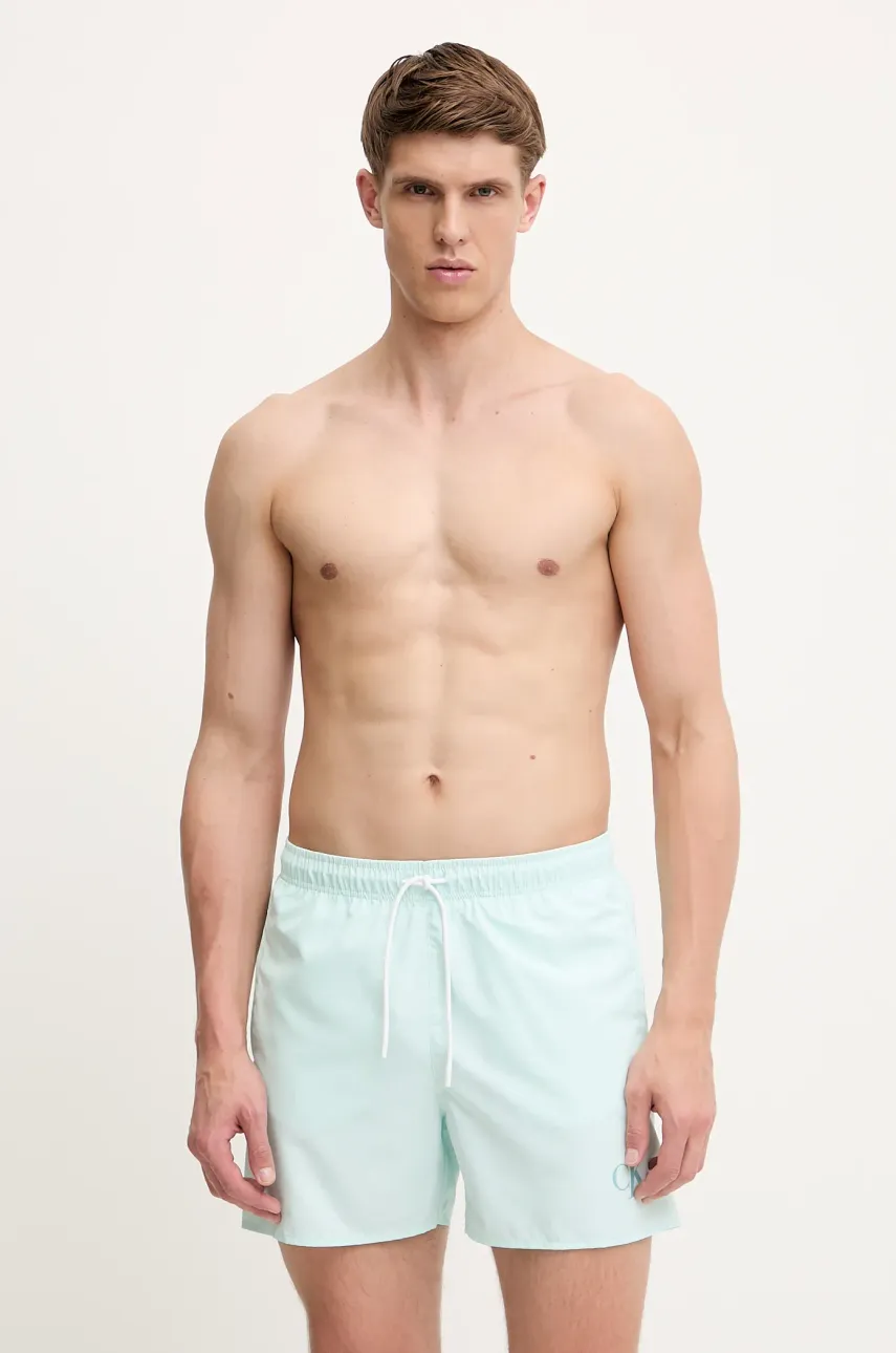 Levně Plavkové šortky Calvin Klein tyrkysová barva, KM0KM01101