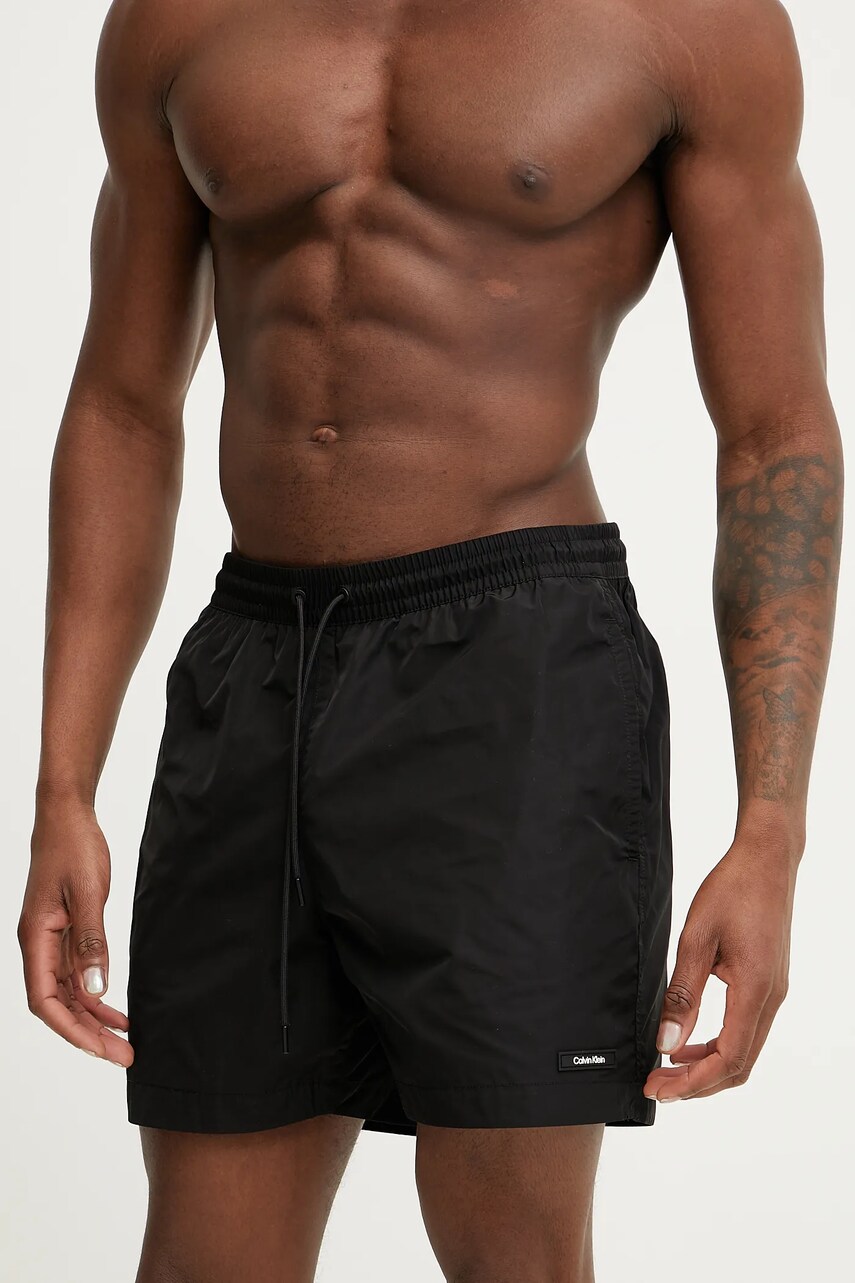 Levně Plavkové šortky Calvin Klein černá barva, KM0KM01111