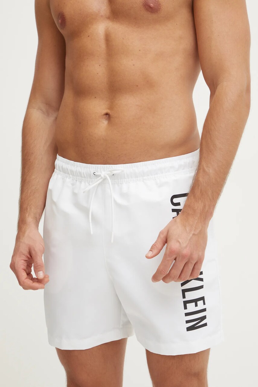 Levně Plavkové šortky Calvin Klein bílá barva, KM0KM01092