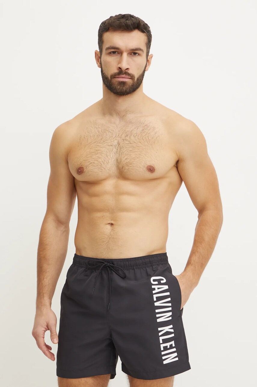 Levně Plavkové šortky Calvin Klein černá barva, KM0KM01092