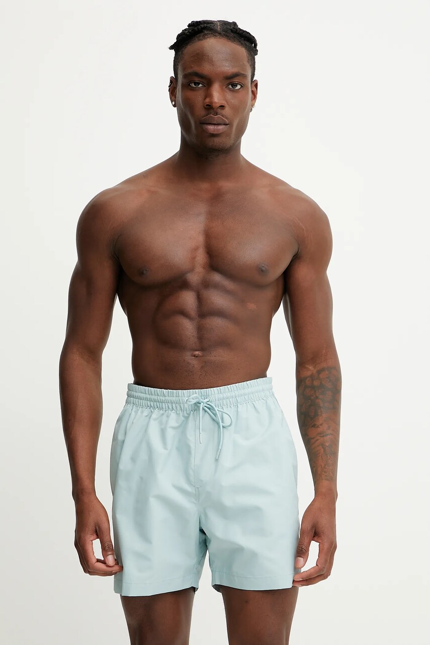 Levně Plavkové šortky Calvin Klein tyrkysová barva, KM0KM01109