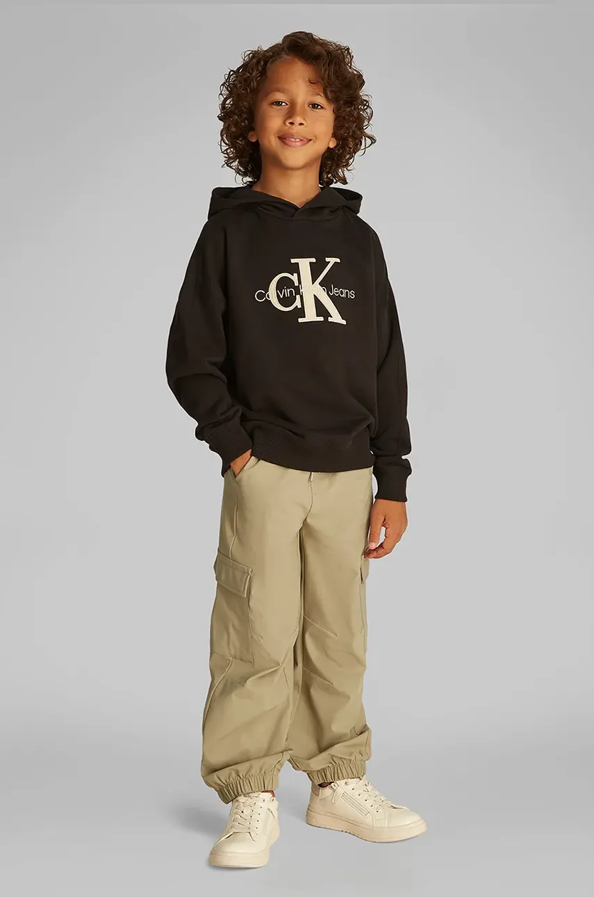 Levně Dětská mikina Calvin Klein Jeans černá barva, s kapucí, s aplikací, IB0IB02464