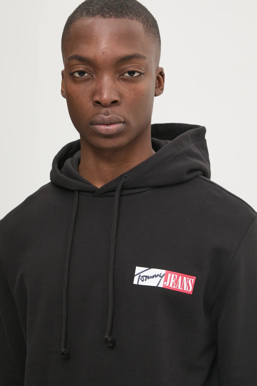 Дитяча бавовняна кофта Tommy Jeans чоловіча колір чорний з капюшоном з принтом DM0DM20257 
