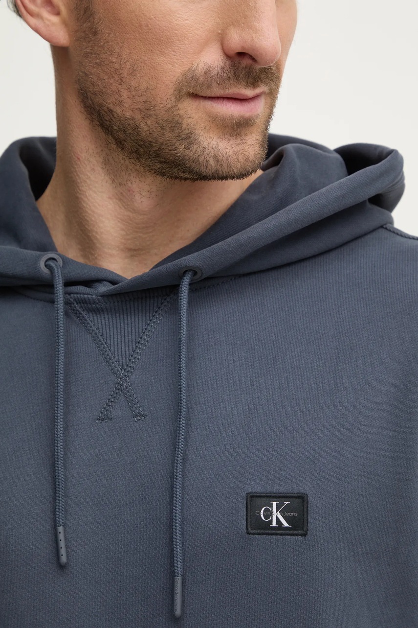 Бавовняна кофта Calvin Klein Jeans чоловіча колір синій з капюшоном однотонна J30J327113 