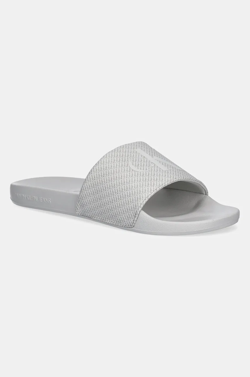 Levně Pantofle Calvin Klein Jeans SLIDE AOP PRINT pánské, šedá barva, YM0YM01269