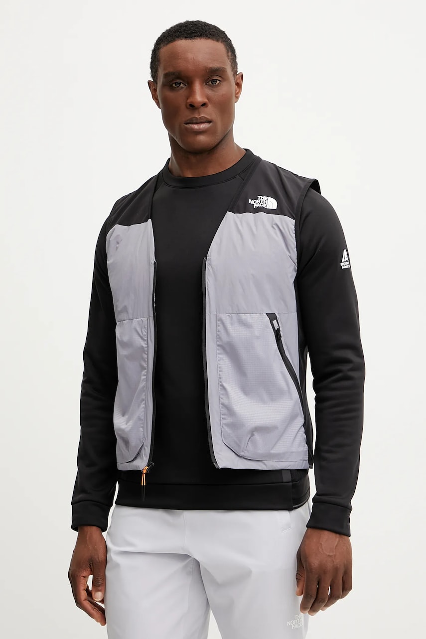 The North Face vestă sport Mountain Athletics culoarea gri, de tranzitie, NF0A8BGR81H1 The North Face vestă sport Mountain Athletics culoarea gri, de tranzitie, NF0A8BGR81H1