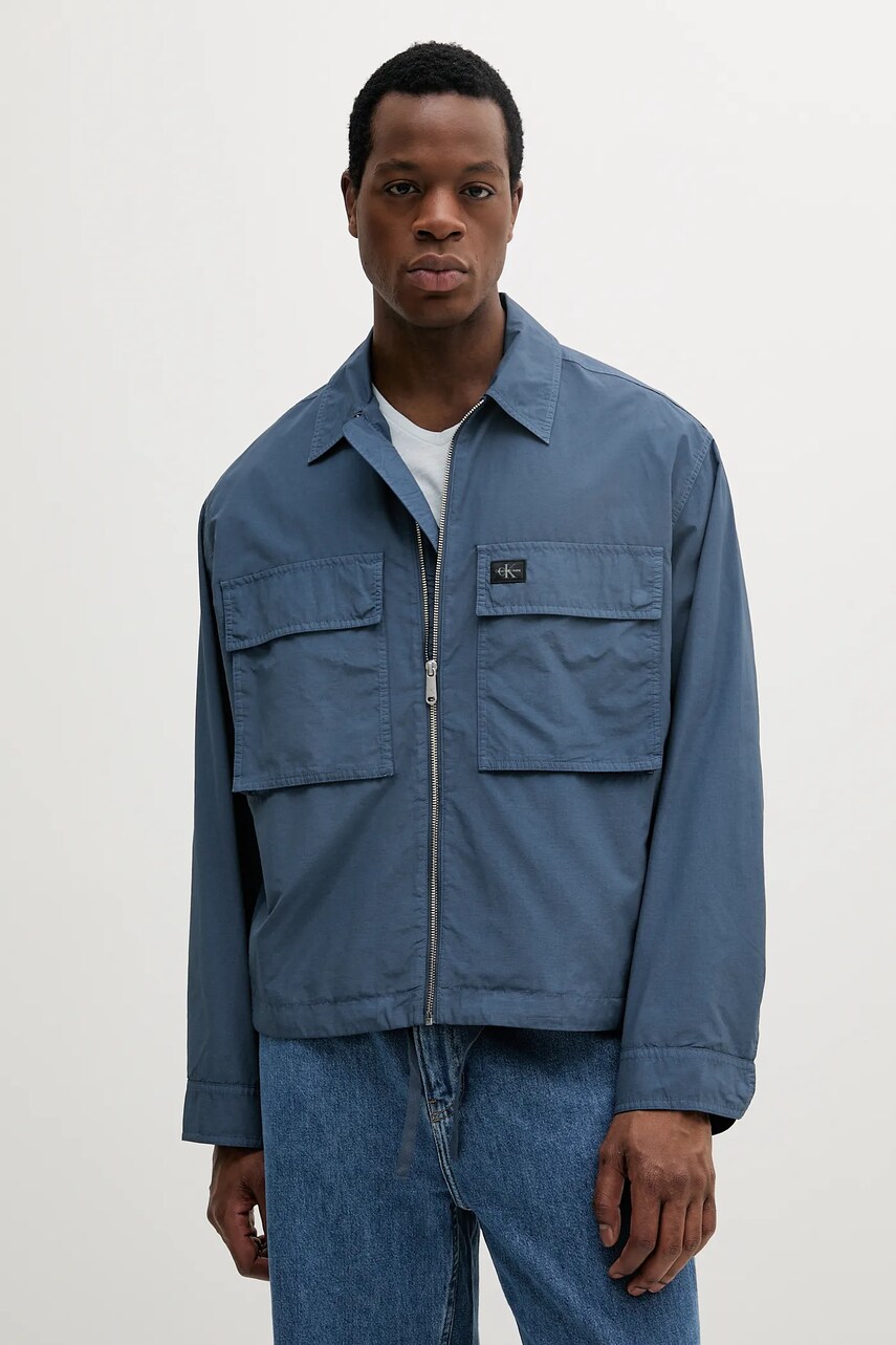 Levně Bunda Calvin Klein Jeans modrá barva, přechodná, oversize, J30J327255